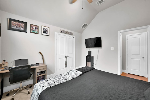 bedroom featuring ceiling fan, lofted ceiling, and light hardwood / wood-style floors