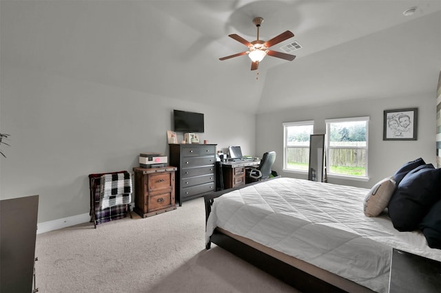 carpeted bedroom with vaulted ceiling and ceiling fan