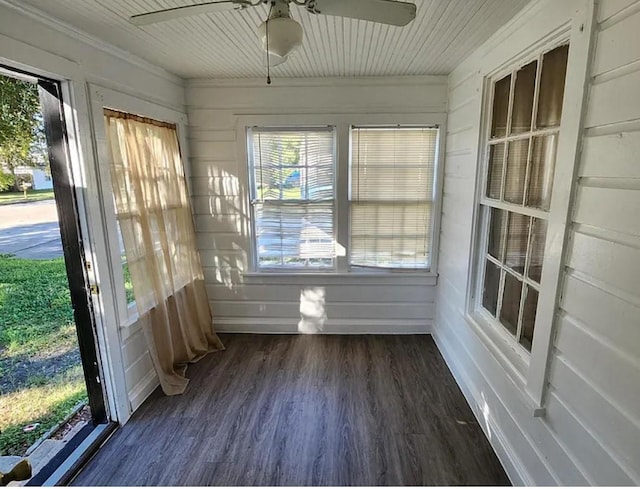 unfurnished sunroom featuring ceiling fan and plenty of natural light