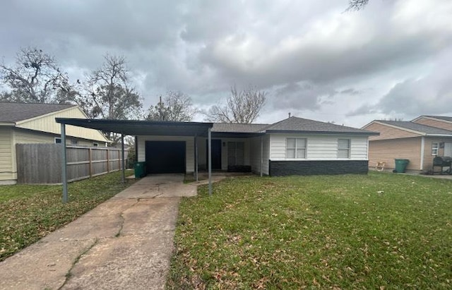 ranch-style home featuring a front lawn, a carport, and a garage