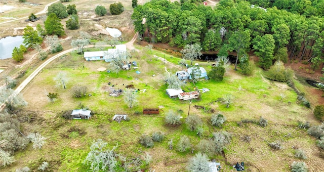 birds eye view of property with a rural view