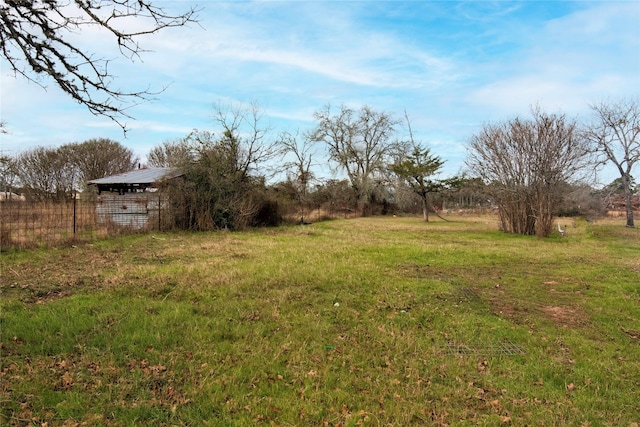 view of yard with a rural view