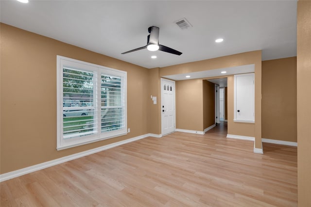 spare room featuring ceiling fan and light hardwood / wood-style floors