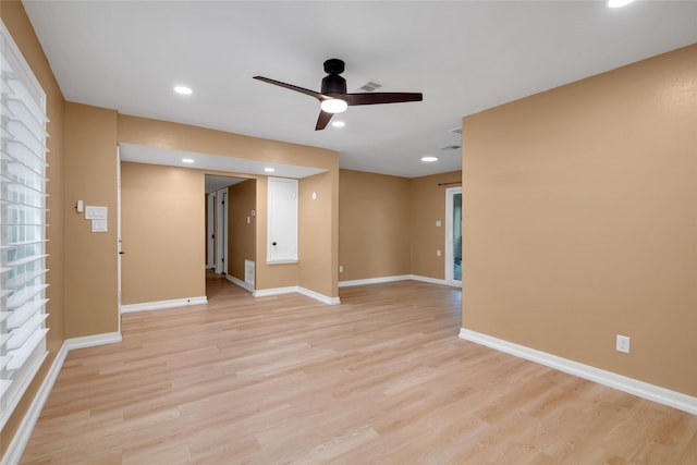 unfurnished room with ceiling fan and light hardwood / wood-style flooring