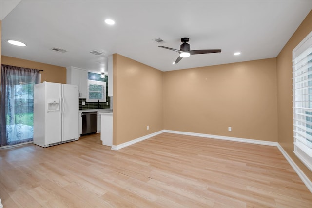 unfurnished living room with ceiling fan, plenty of natural light, and light hardwood / wood-style flooring