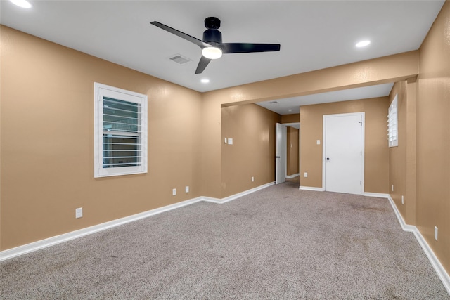 carpeted empty room featuring ceiling fan