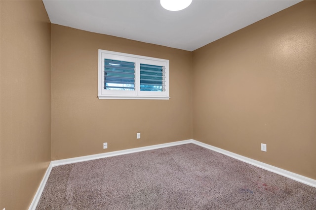 spare room featuring carpet floors