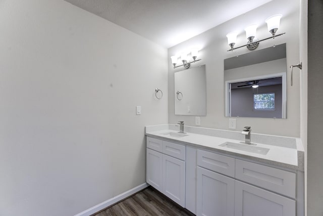 bathroom featuring ceiling fan, vanity, and hardwood / wood-style floors