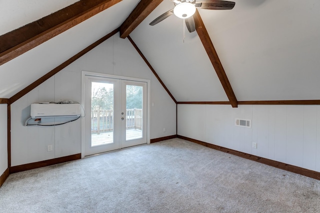 additional living space with ceiling fan, light colored carpet, french doors, and vaulted ceiling