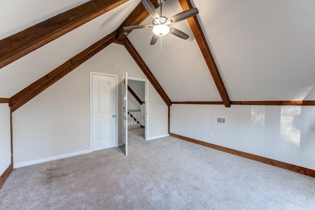 additional living space featuring vaulted ceiling, ceiling fan, and light colored carpet