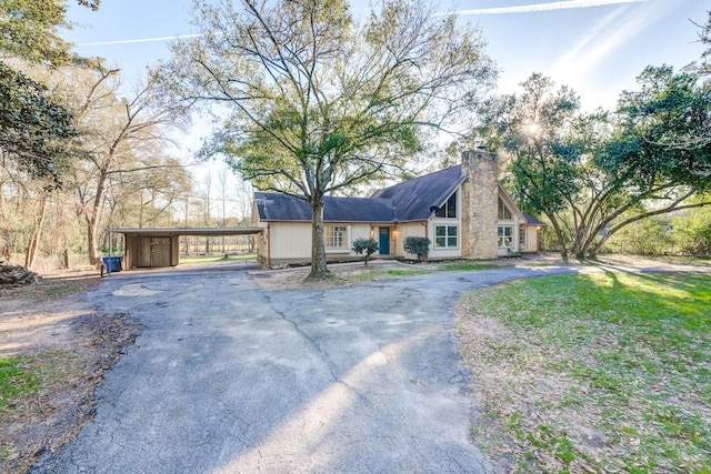 view of front of property featuring a carport