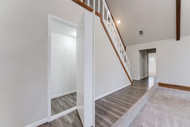 stairway featuring wood-type flooring