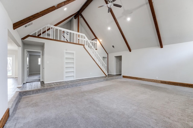 unfurnished living room with carpet floors, ceiling fan, built in features, high vaulted ceiling, and beam ceiling