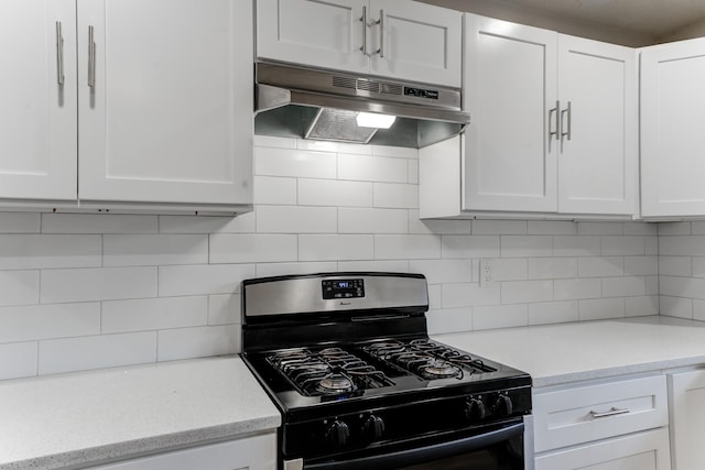 kitchen featuring backsplash, white cabinets, and black range with gas stovetop