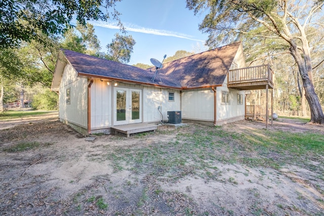 rear view of property with central air condition unit and french doors