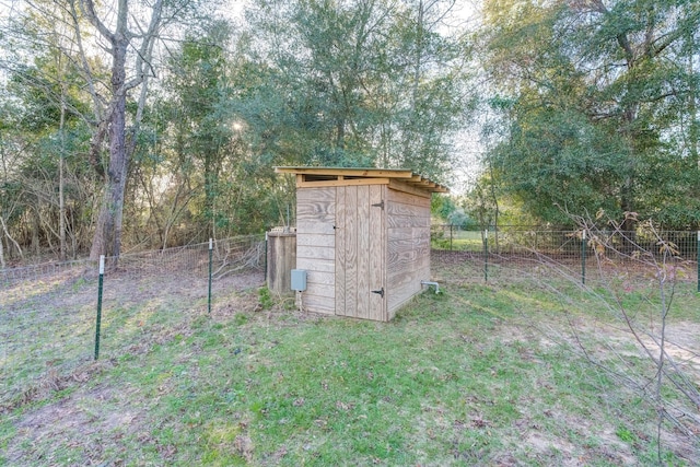 view of outbuilding with a lawn