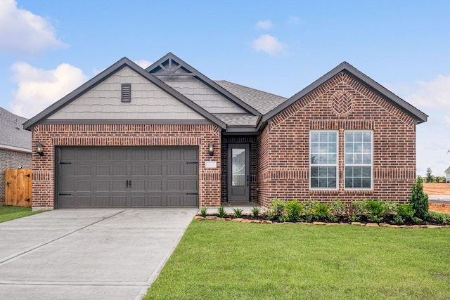 view of front of home with a garage and a front lawn