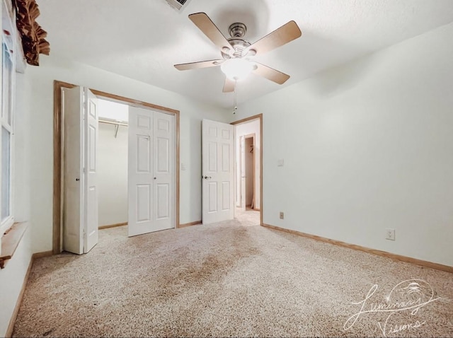 unfurnished bedroom with ceiling fan, a closet, and carpet floors