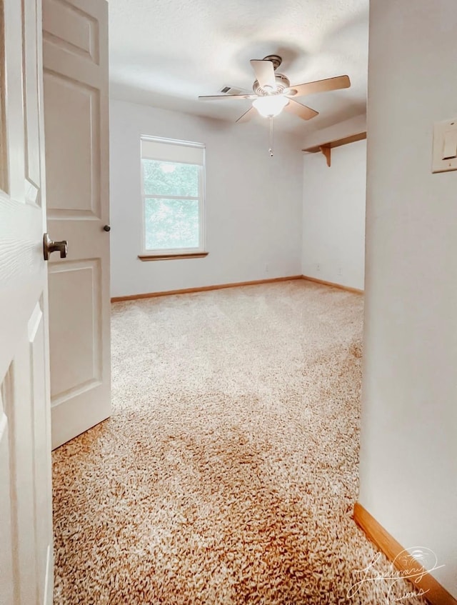 unfurnished room featuring ceiling fan