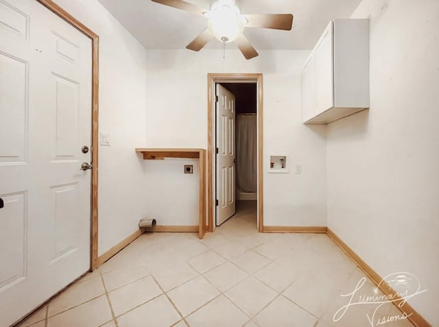 laundry room featuring cabinets, light tile patterned floors, ceiling fan, and electric dryer hookup