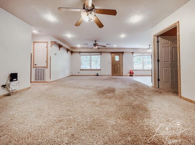 unfurnished living room with carpet