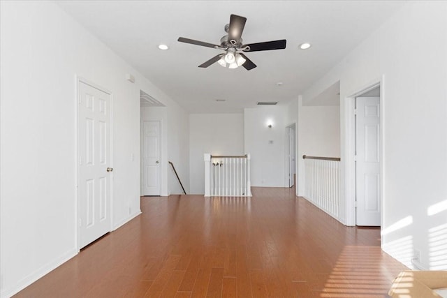 spare room with ceiling fan and wood-type flooring