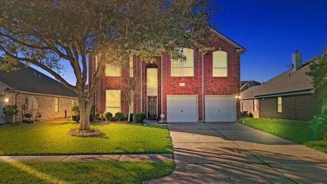 view of property featuring a front yard and a garage