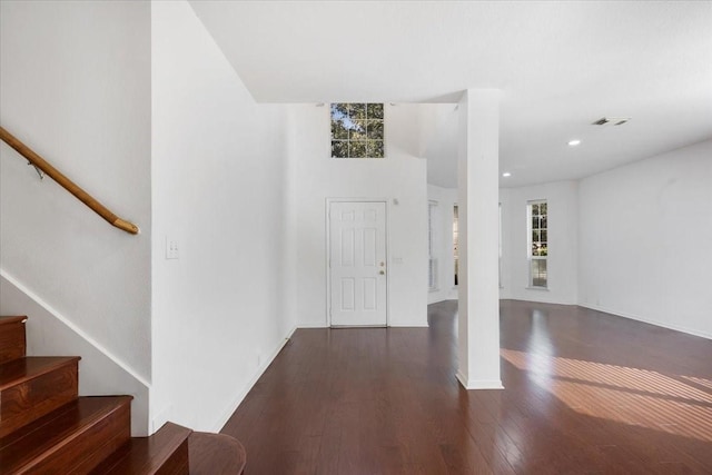 foyer with dark hardwood / wood-style flooring