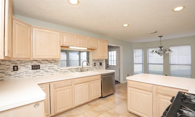 kitchen featuring decorative light fixtures, dishwasher, sink, an inviting chandelier, and light brown cabinetry