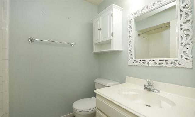 bathroom with toilet and vanity