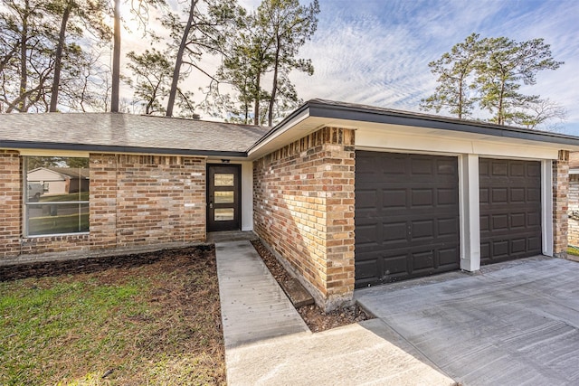 view of exterior entry with a garage