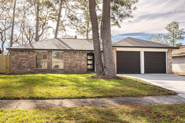 ranch-style home with a garage and a front lawn