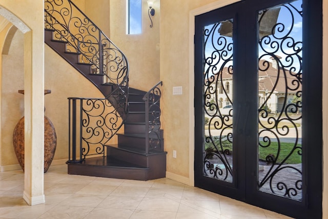 foyer entrance featuring french doors