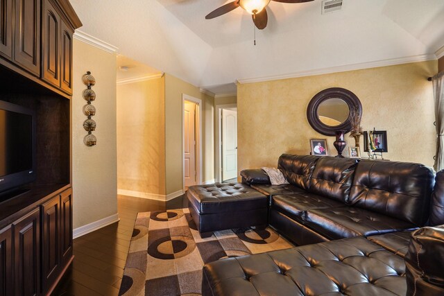 living room featuring ceiling fan, dark hardwood / wood-style floors, crown molding, and vaulted ceiling