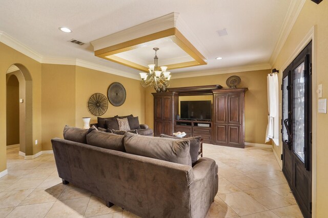 living room with crown molding, an inviting chandelier, light tile patterned floors, and a raised ceiling