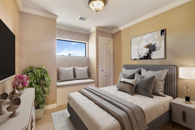 carpeted bedroom with a textured ceiling and ornamental molding