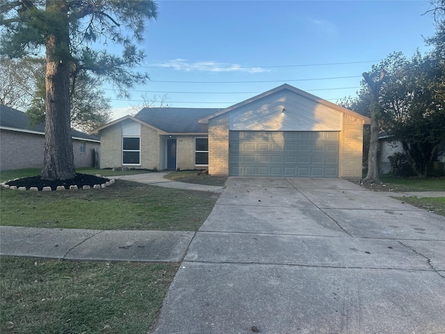 ranch-style home with a front yard and a garage