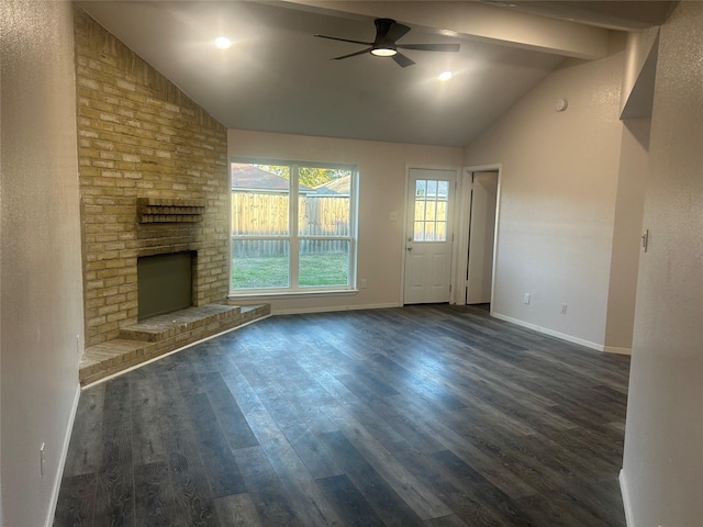 unfurnished living room with ceiling fan, a brick fireplace, vaulted ceiling, and dark wood-type flooring