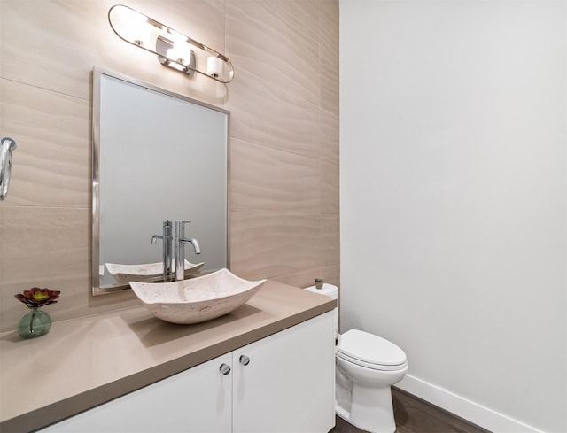 bathroom with toilet and vanity