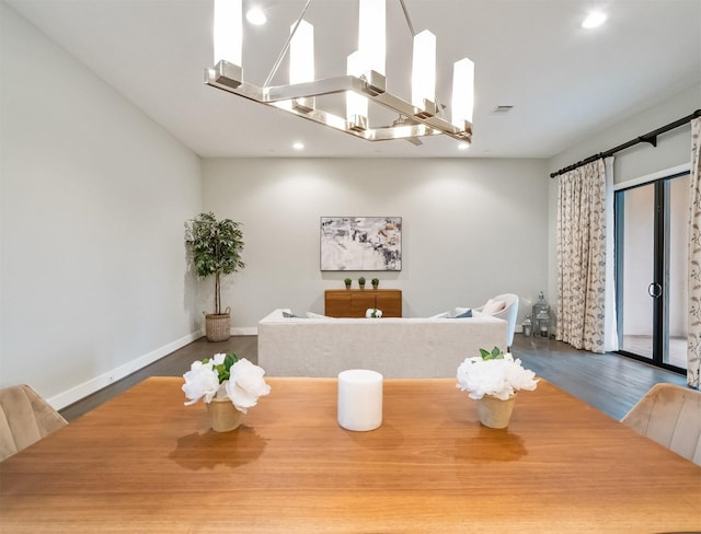 dining room with a chandelier and hardwood / wood-style flooring