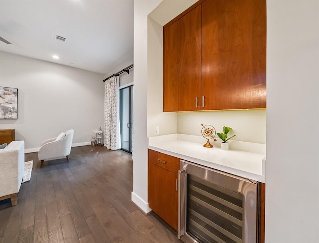 kitchen with wine cooler and dark hardwood / wood-style flooring