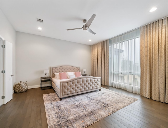 bedroom featuring ceiling fan and dark hardwood / wood-style flooring