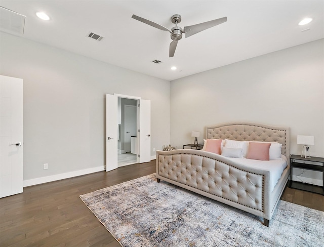 bedroom featuring ceiling fan and dark hardwood / wood-style floors