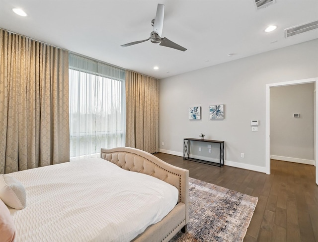 bedroom with ceiling fan and dark hardwood / wood-style floors