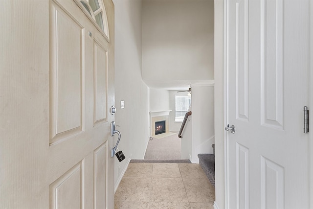 hall with light tile patterned floors