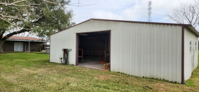 view of pole building with a yard