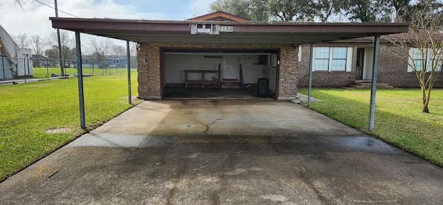 view of car parking with a carport, concrete driveway, fence, and an attached garage