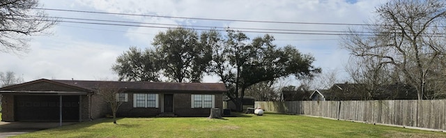 single story home featuring a garage, driveway, fence, and a front yard