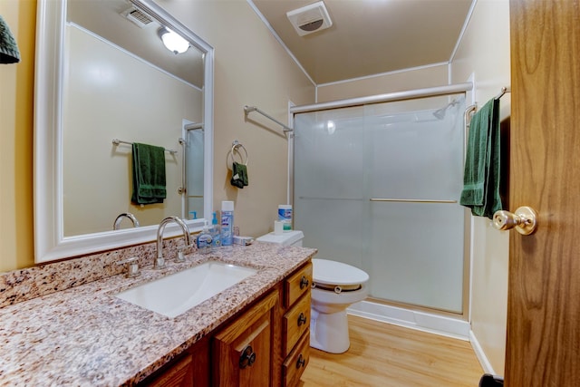 2180 Washington Ave, Alvin, TX 77511 - full bath featuring a shower stall, crown molding, visible vents, wood finished floors, and vanity