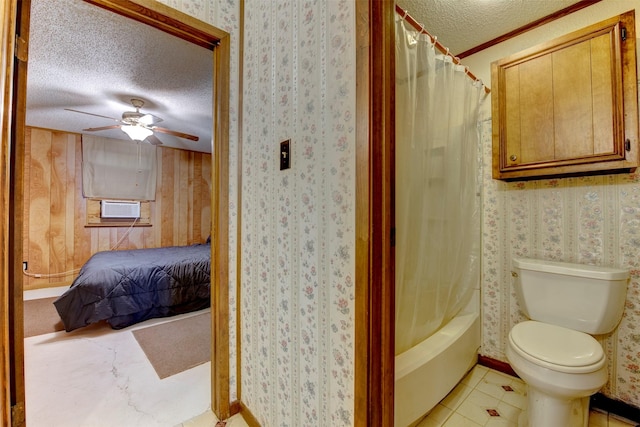 2180 Washington Ave, Alvin, TX 77511 - bathroom featuring a textured ceiling, toilet, a ceiling fan, and shower / tub combo